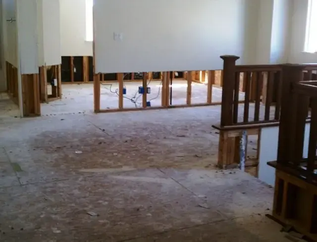 Rooms opened up with drywall removed at the base during a Modesto water damage dry-out