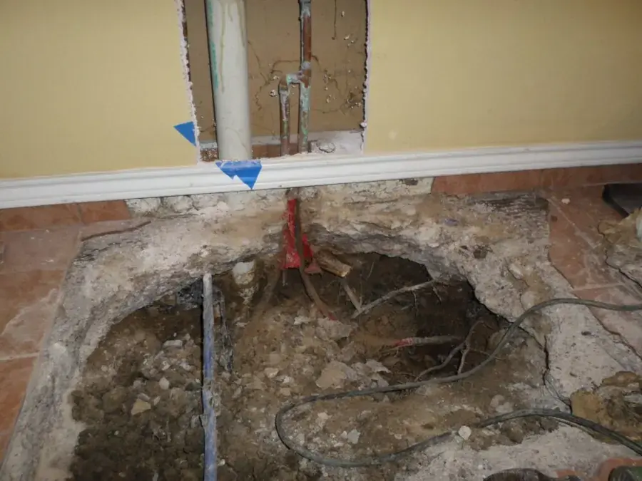 Concrete slab opened to reach a leaking supply line under a Modesto home